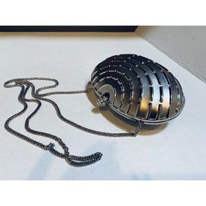 An Evening Silver Metal Clutch/Purse with a Strap.